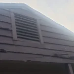 Close up of the siding of a two story home.