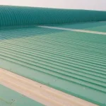Close up of a white metal roof in broad daylight.