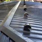 Black metal roof, freshly installed.