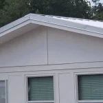 White metal roof on a single story home.