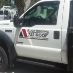 Close up of a truck with the sign "Align Roofing".