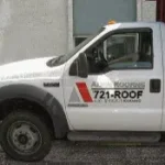 Close up of a truck with the sign "Align Roofing".
